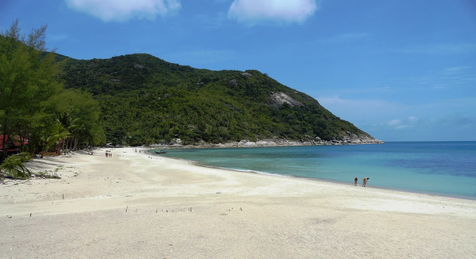 White sand and a wooded headland at Bottle Beach on Koh Phangan