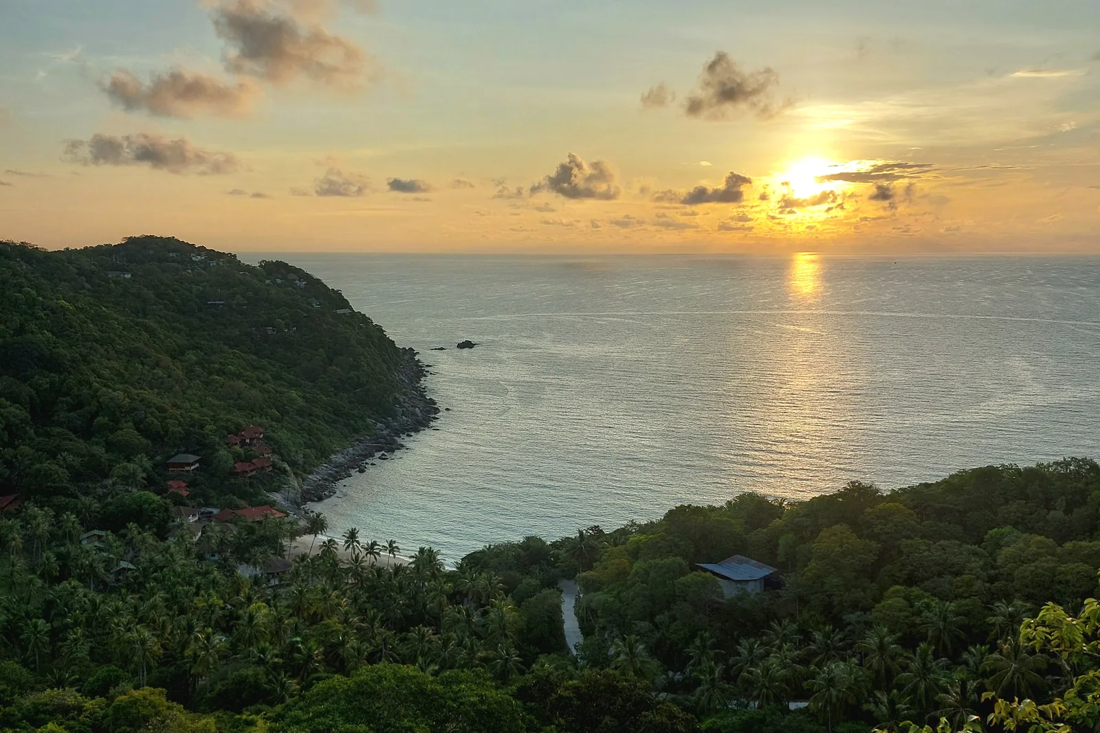 Sunrise above Ao Leuk bay and wooded slopes on Koh Tao
